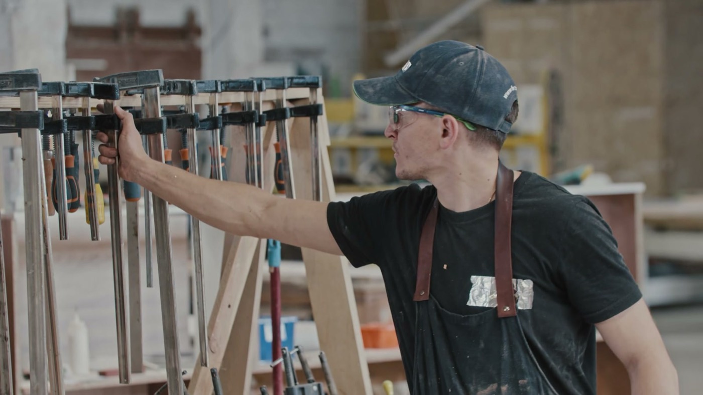Carpenter reaching for a tool